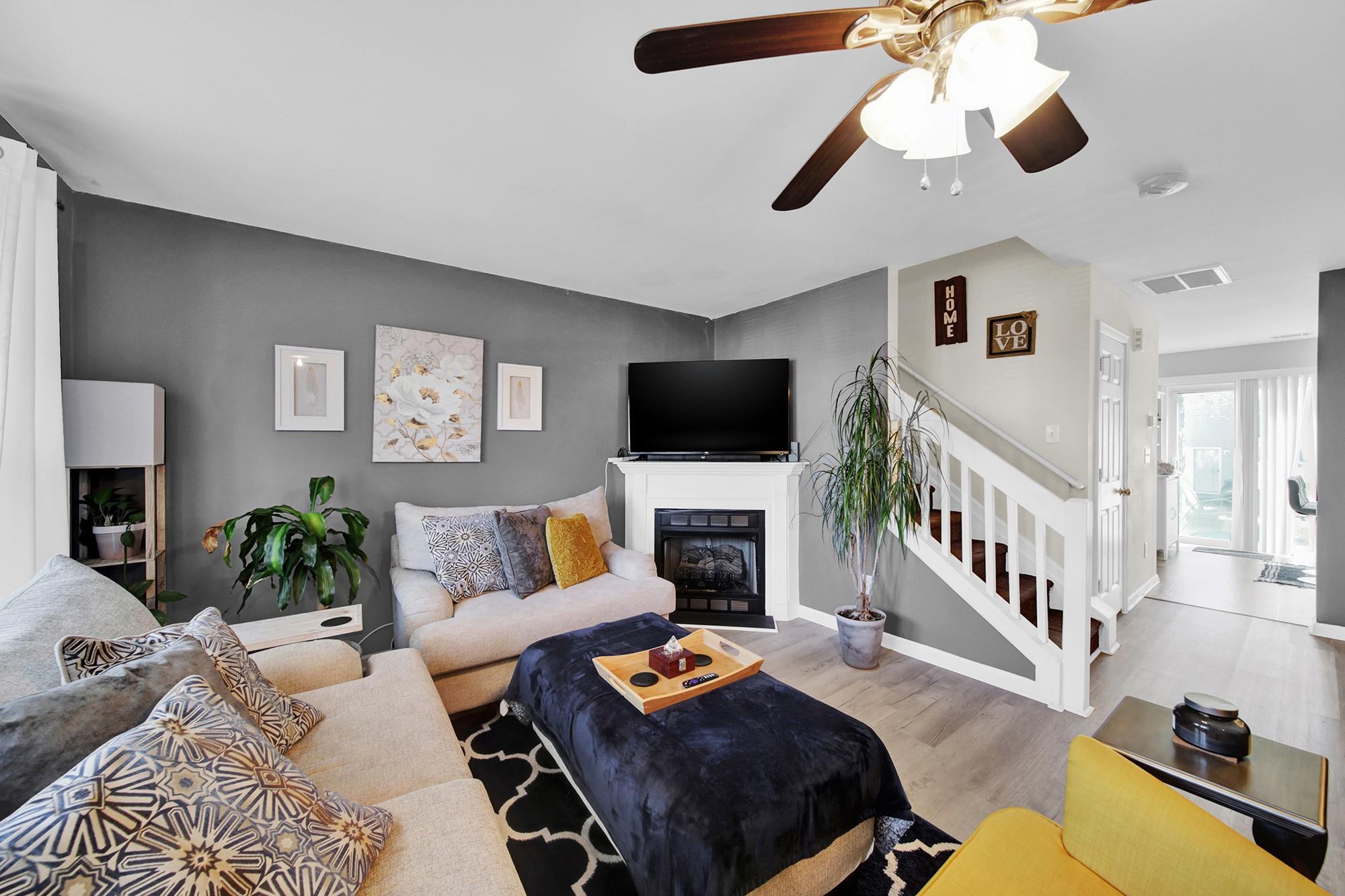 11223 Grass Field Road Charlotte, NC 28213 - Photo 4 of 25 a living room with furniture and a flat screen tv