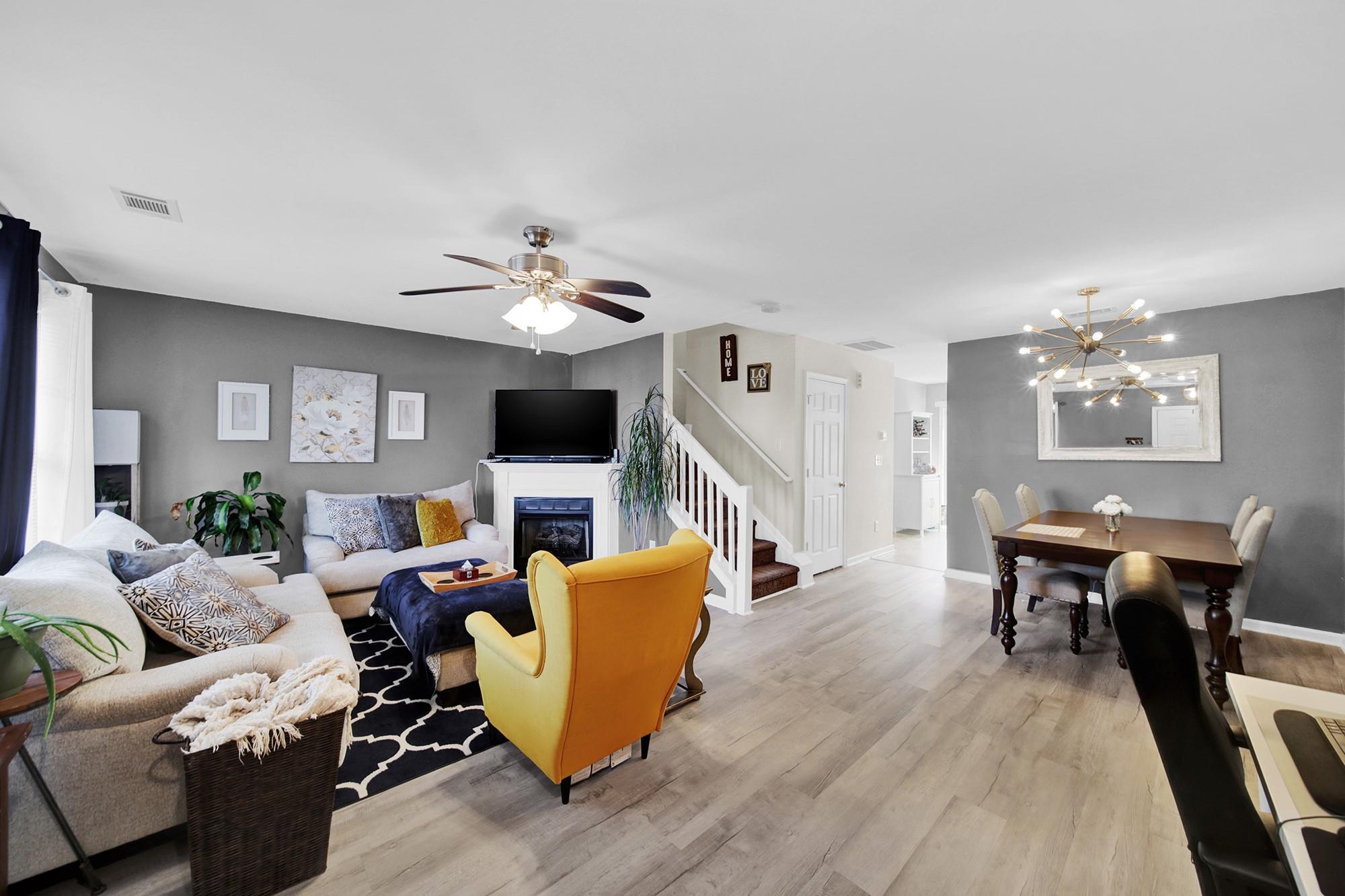 11223 Grass Field Road Charlotte, NC 28213 - Photo 5 of 25 a living room with furniture or chandelier and a wooden floor