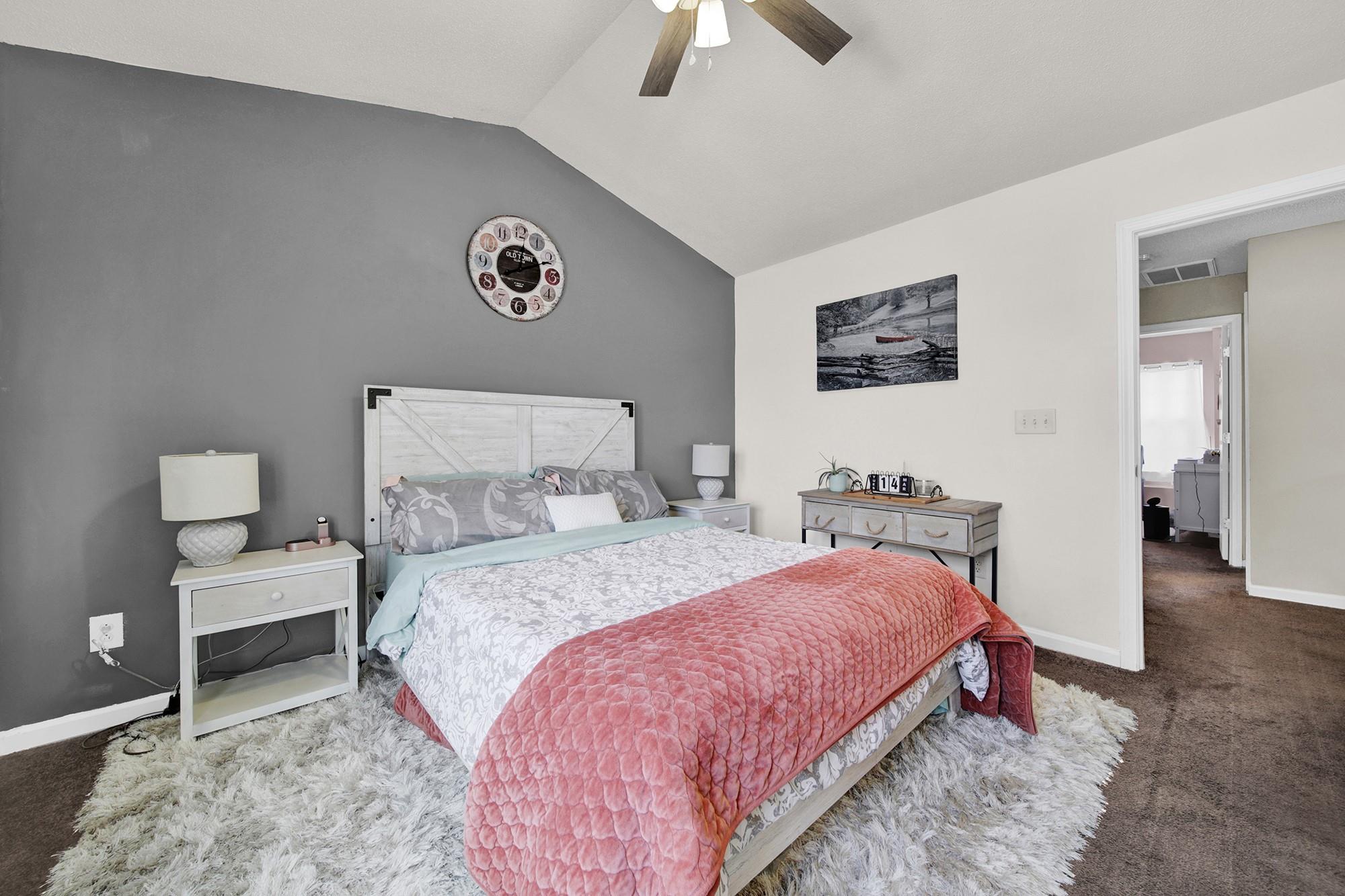 11223 Grass Field Road Charlotte, NC 28213 - Photo 9 of 25 a bedroom with bed and a chandelier