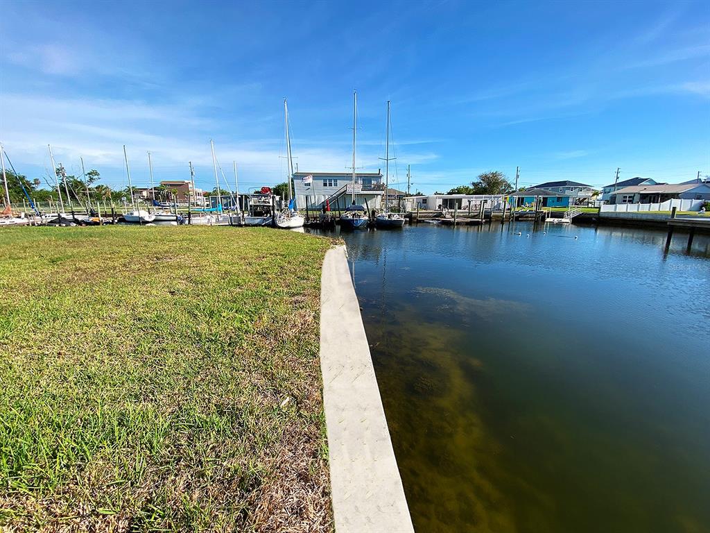 218 Northeast Evelane Drive Hudson, FL 34667 - Photo 6 of 6 a view of a lake with boats