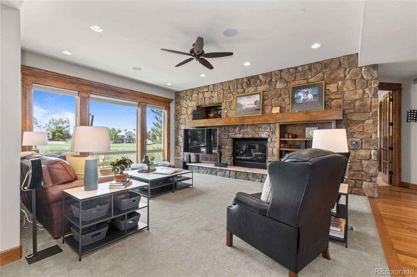 1291 Buffalo Ridge Road Castle Pines, CO 80108 - Photo 13 of 39 a living room with furniture and a fireplace