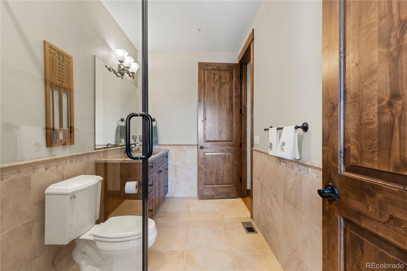 1291 Buffalo Ridge Road Castle Pines, CO 80108 - Photo 15 of 39 a bathroom with a toilet and a sink