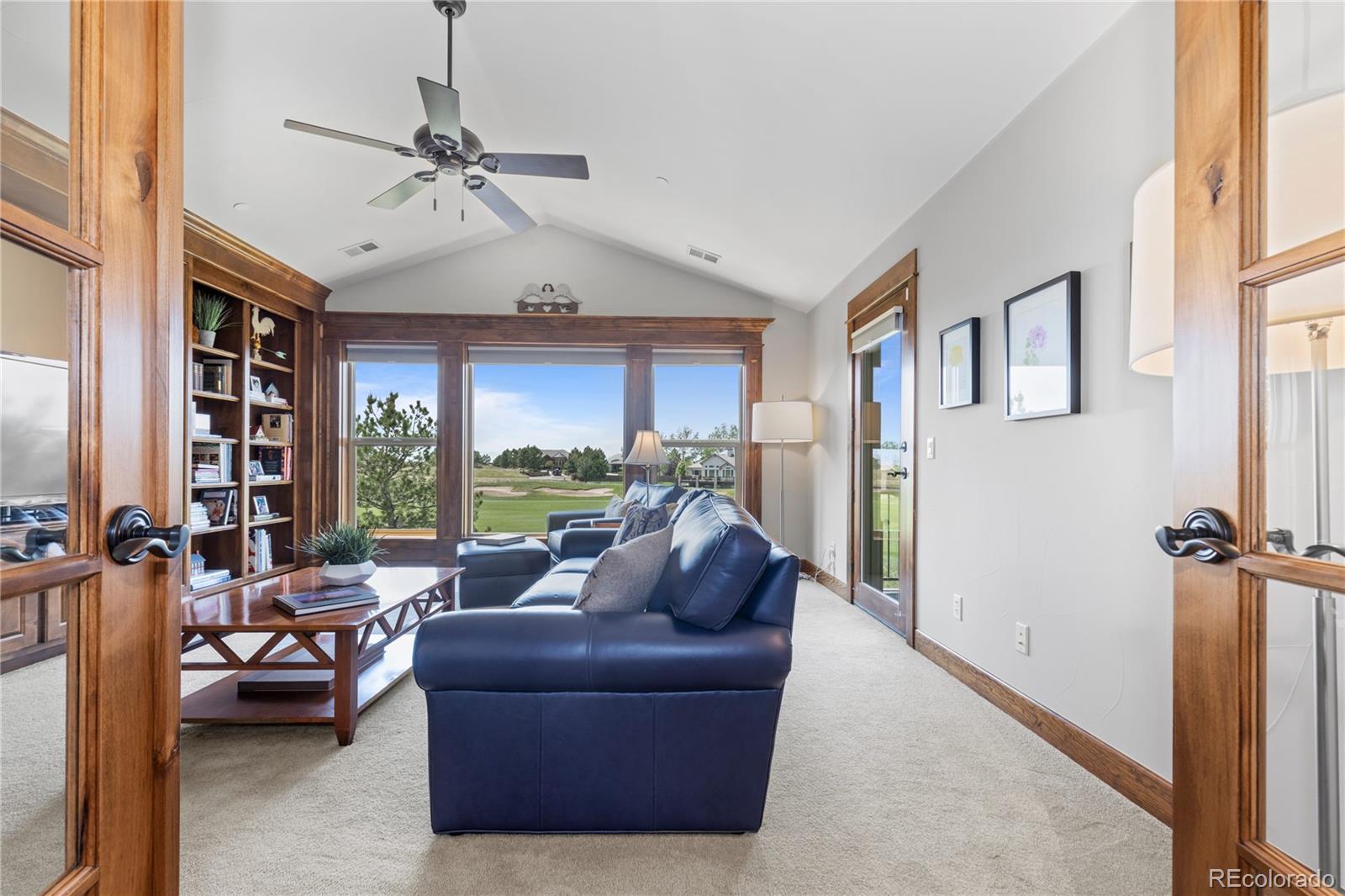 1291 Buffalo Ridge Road Castle Pines, CO 80108 - Photo 17 of 39 a living room with furniture and a large window