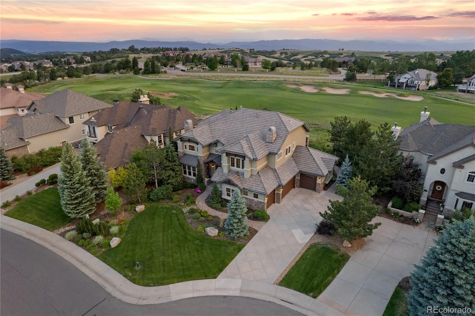 1291 Buffalo Ridge Road Castle Pines, CO 80108 - Photo 2 of 39 a view of a garden with an outdoor space