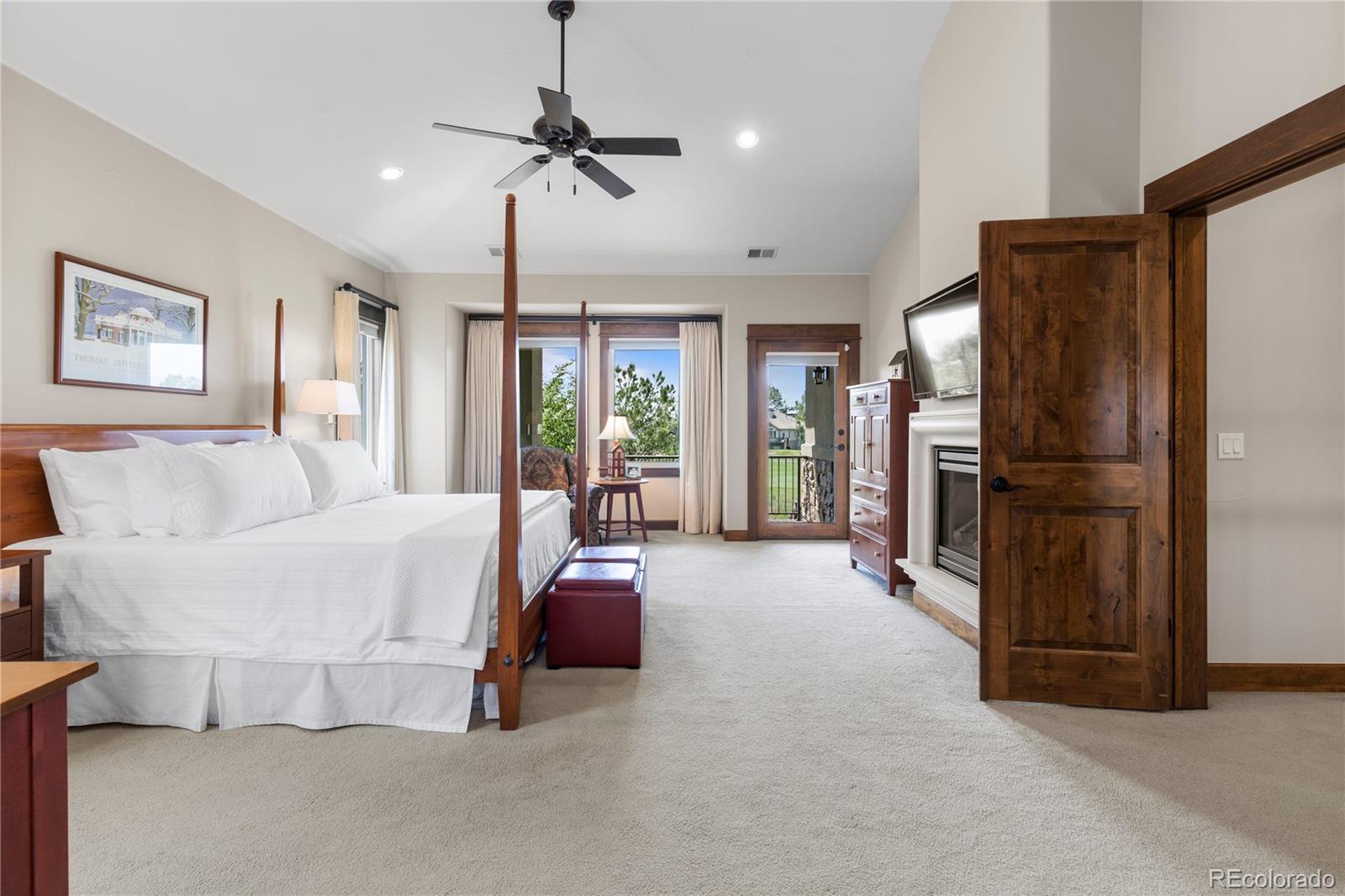 1291 Buffalo Ridge Road Castle Pines, CO 80108 - Photo 21 of 39 a living room with furniture and a refrigerator