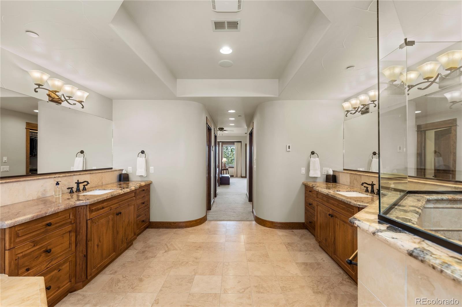 1291 Buffalo Ridge Road Castle Pines, CO 80108 - Photo 23 of 39 a view of a kitchen island a sink and dishwasher with a large kitchen island