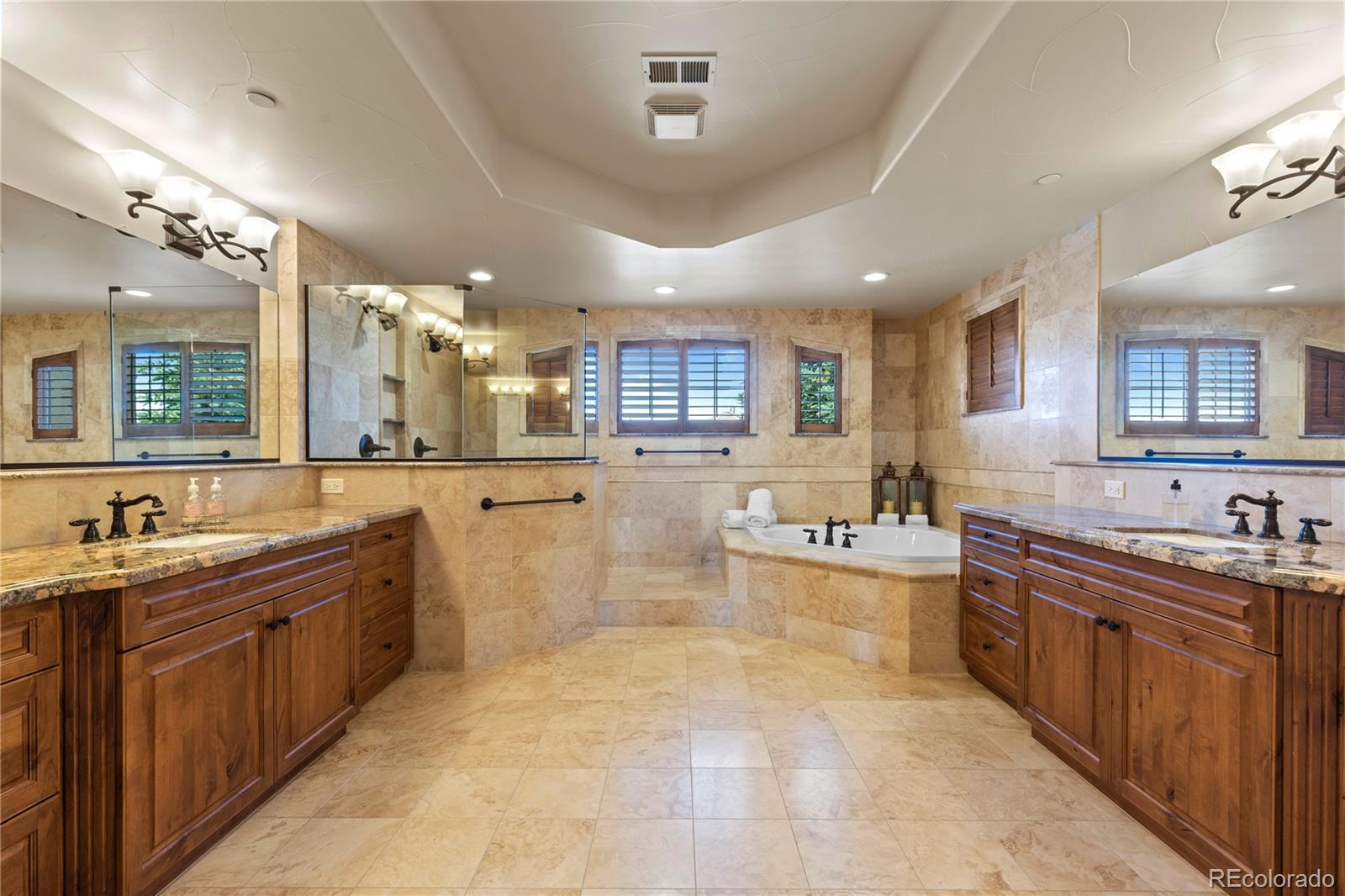 1291 Buffalo Ridge Road Castle Pines, CO 80108 - Photo 24 of 39 a large kitchen with a large counter top space sink and stainless steel appliances