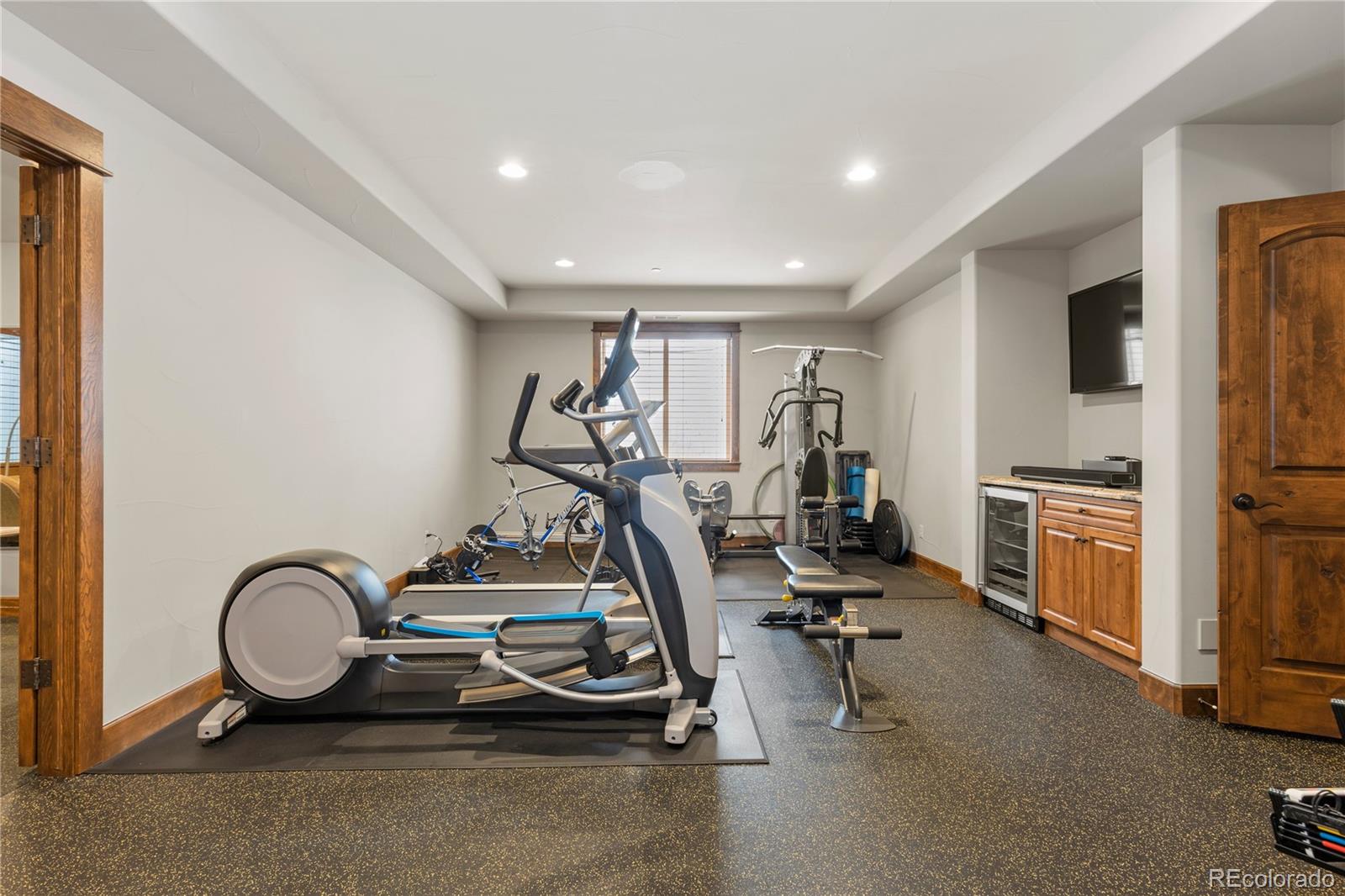 1291 Buffalo Ridge Road Castle Pines, CO 80108 - Photo 30 of 39 a view of a room with gym equipment