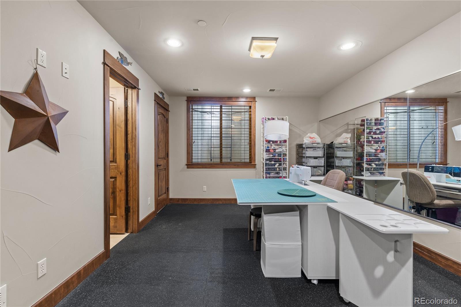 1291 Buffalo Ridge Road Castle Pines, CO 80108 - Photo 31 of 39 a room with furniture a large window and a sink