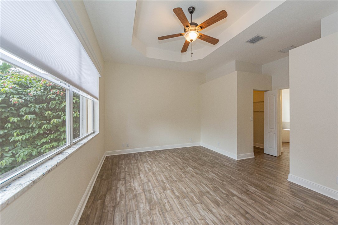 5952 Spanish River Road Fort Pierce, FL 34951 - Photo 11 of 35 wooden floor in an empty room with a window