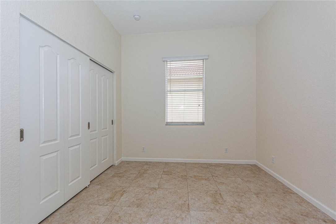 5952 Spanish River Road Fort Pierce, FL 34951 - Photo 21 of 35 an empty room with windows