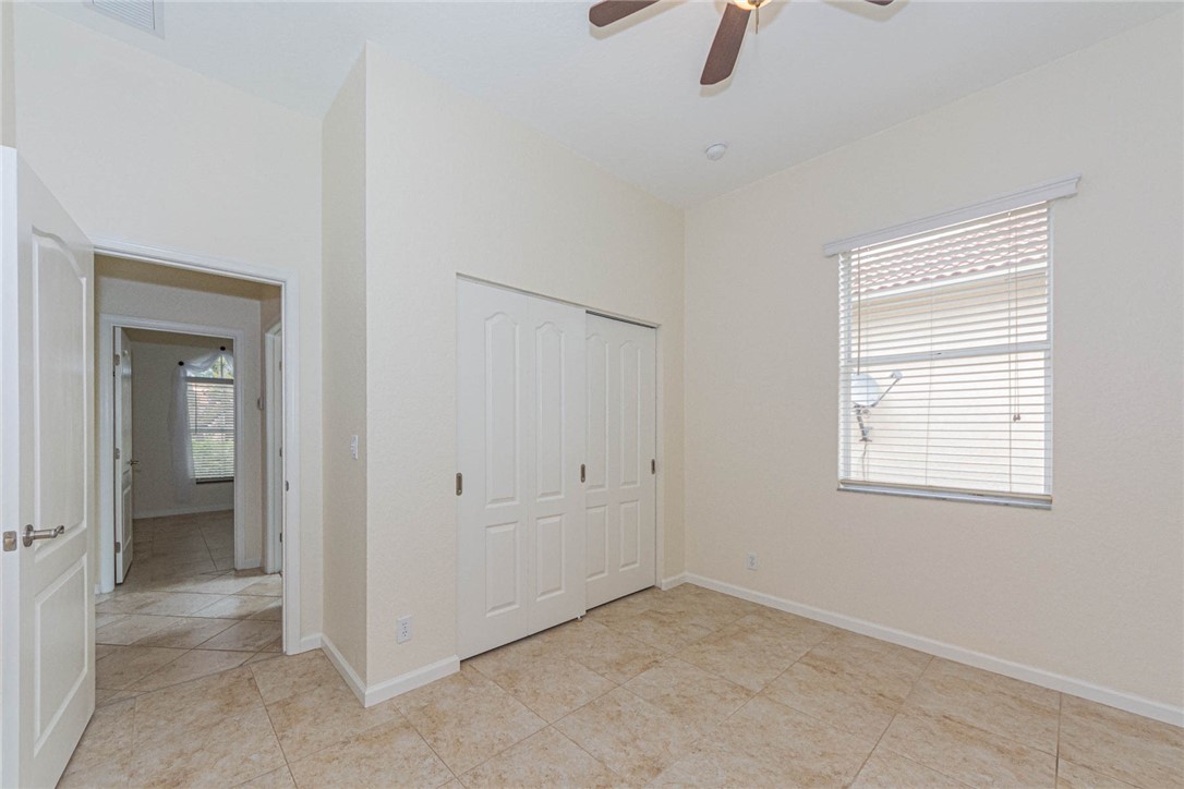 5952 Spanish River Road Fort Pierce, FL 34951 - Photo 23 of 35 an empty room with windows and closet