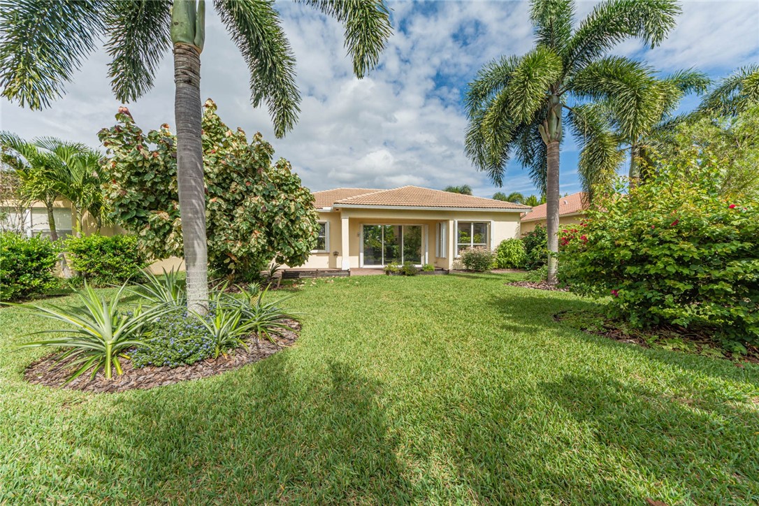 5952 Spanish River Road Fort Pierce, FL 34951 - Photo 28 of 35 a view of house that has a yard