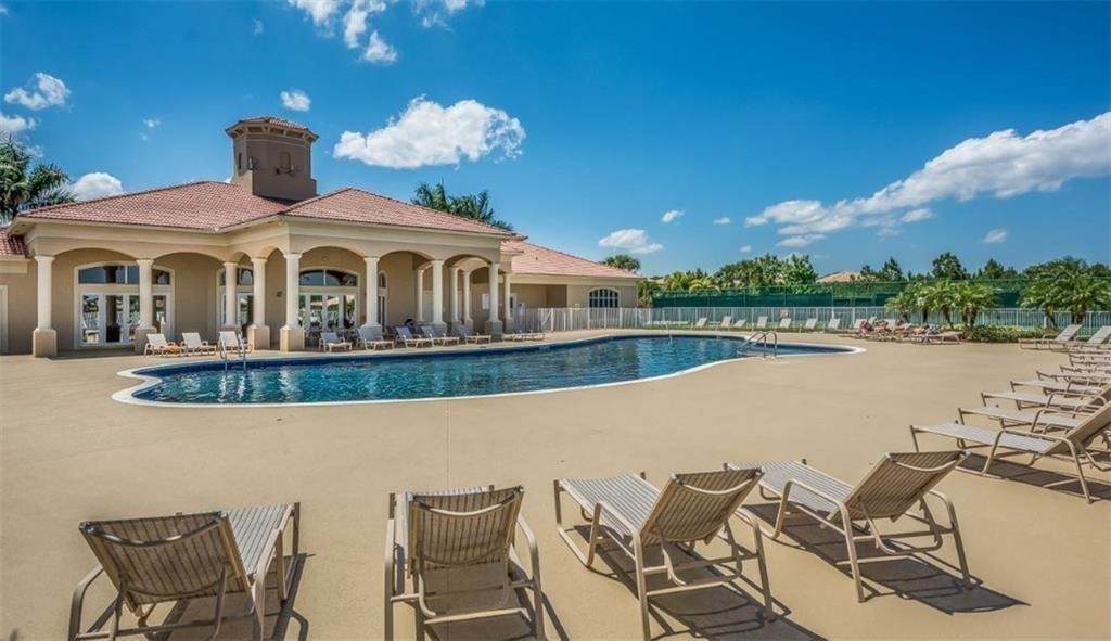 5952 Spanish River Road Fort Pierce, FL 34951 - Photo 32 of 35 a front view of a house with swimming pool and sitting area