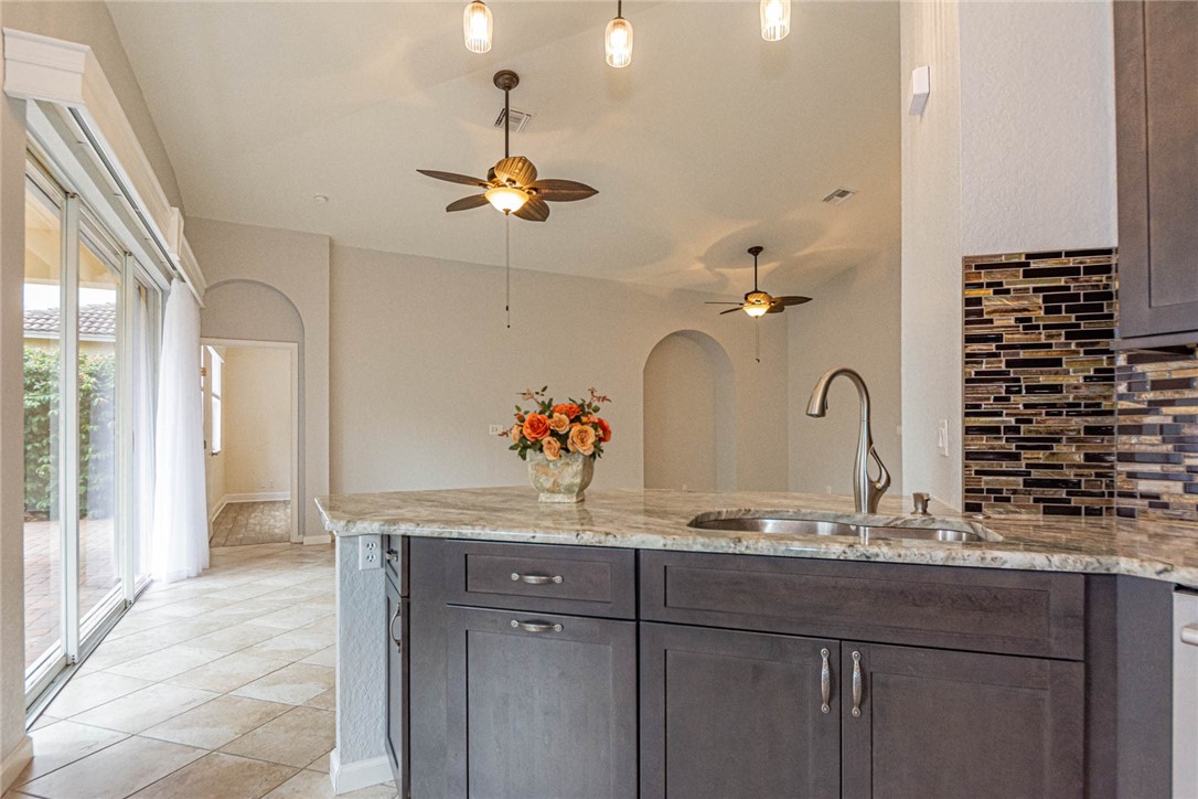 5952 Spanish River Road Fort Pierce, FL 34951 - Photo 10 of 35 a bathroom with a granite countertop sink a mirror and shower view