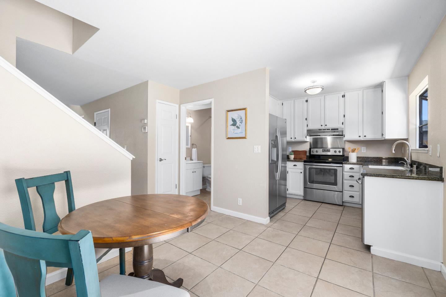 164 Weeks Drive Watsonville, CA 95076 - Photo 11 of 37 a kitchen with cabinets and refrigerator