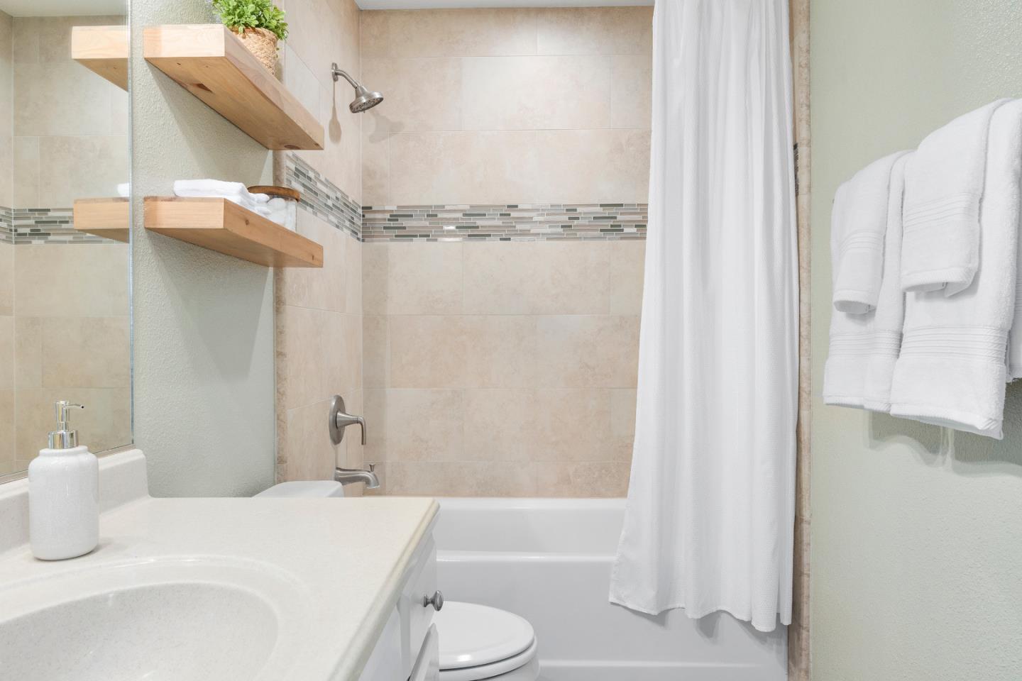 164 Weeks Drive Watsonville, CA 95076 - Photo 19 of 37 a bathroom with a sink toilet and shower