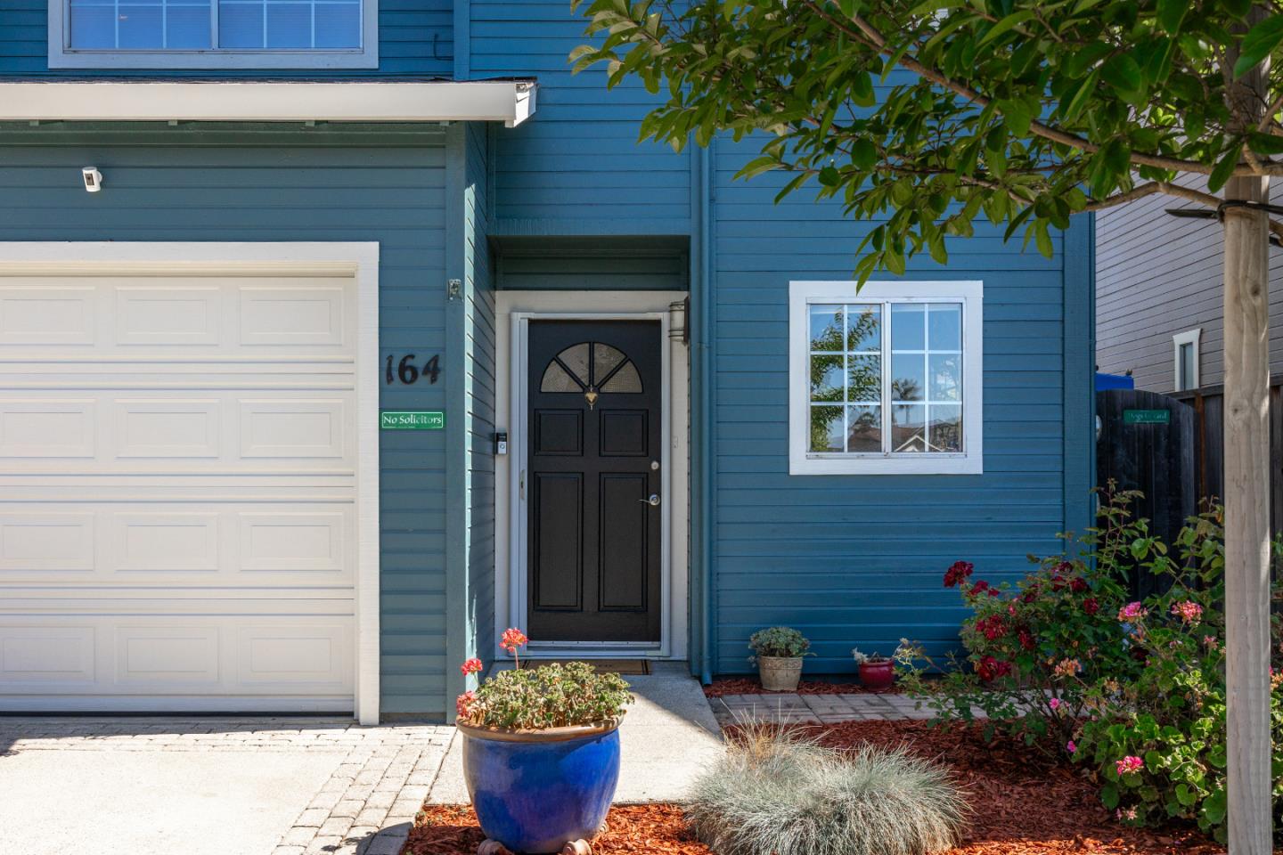 164 Weeks Drive Watsonville, CA 95076 - Photo 32 of 37 a front view of a house with potted plants