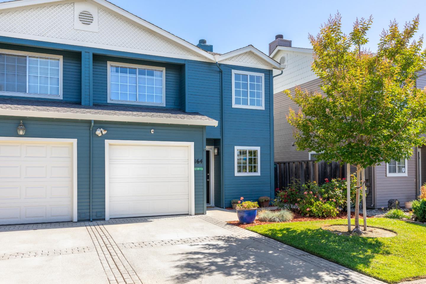 164 Weeks Drive Watsonville, CA 95076 - Photo 33 of 37 a front view of a house with a yard garage and outdoor seating