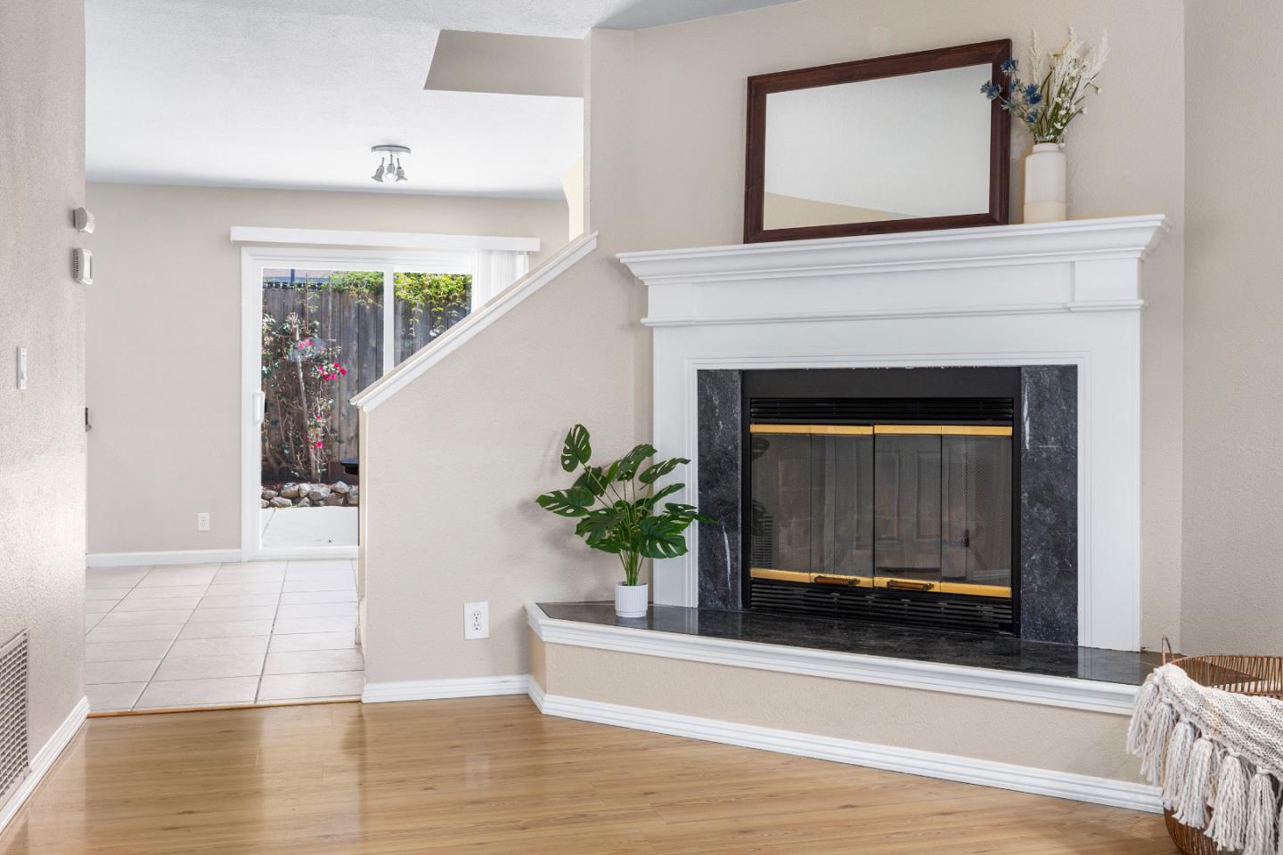164 Weeks Drive Watsonville, CA 95076 - Photo 6 of 37 a living room with a fireplace and a potted plant