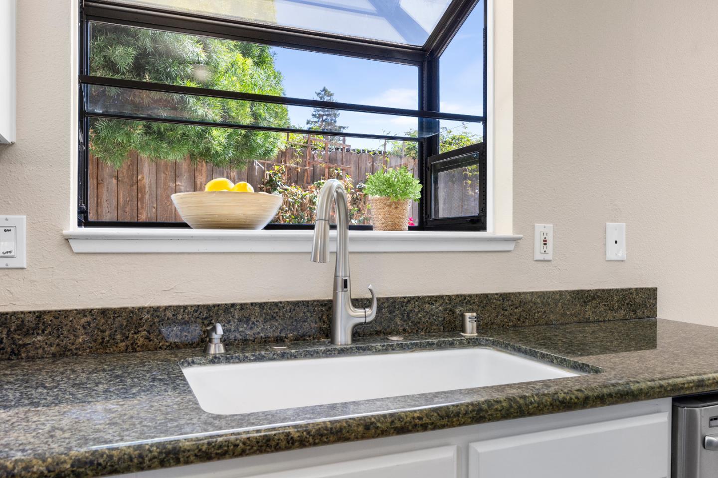 164 Weeks Drive Watsonville, CA 95076 - Photo 9 of 37 a kitchen with a sink and a window