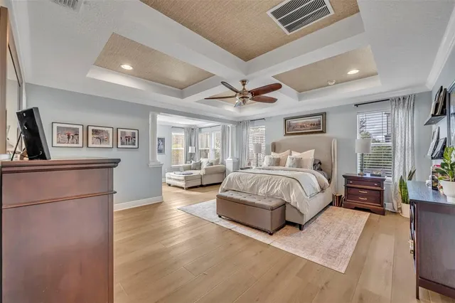 a bedroom with a large bed and a couch