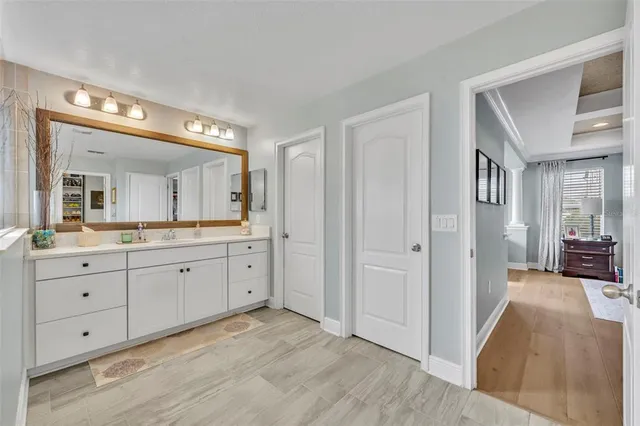 a bed room with bed and a chandelier