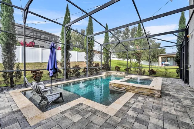 a view of a patio with a table and chairs