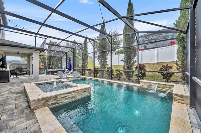 a view of a patio with table and chairs and potted plants