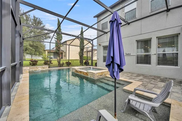 a very nice looking room with a large window and dining space