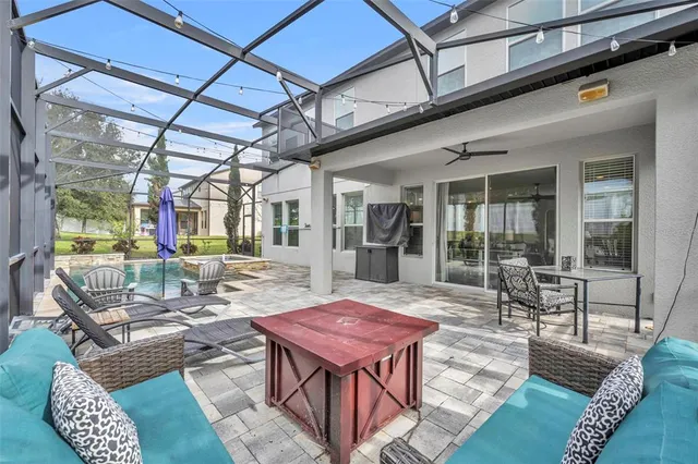a view of a house with yard and sitting area
