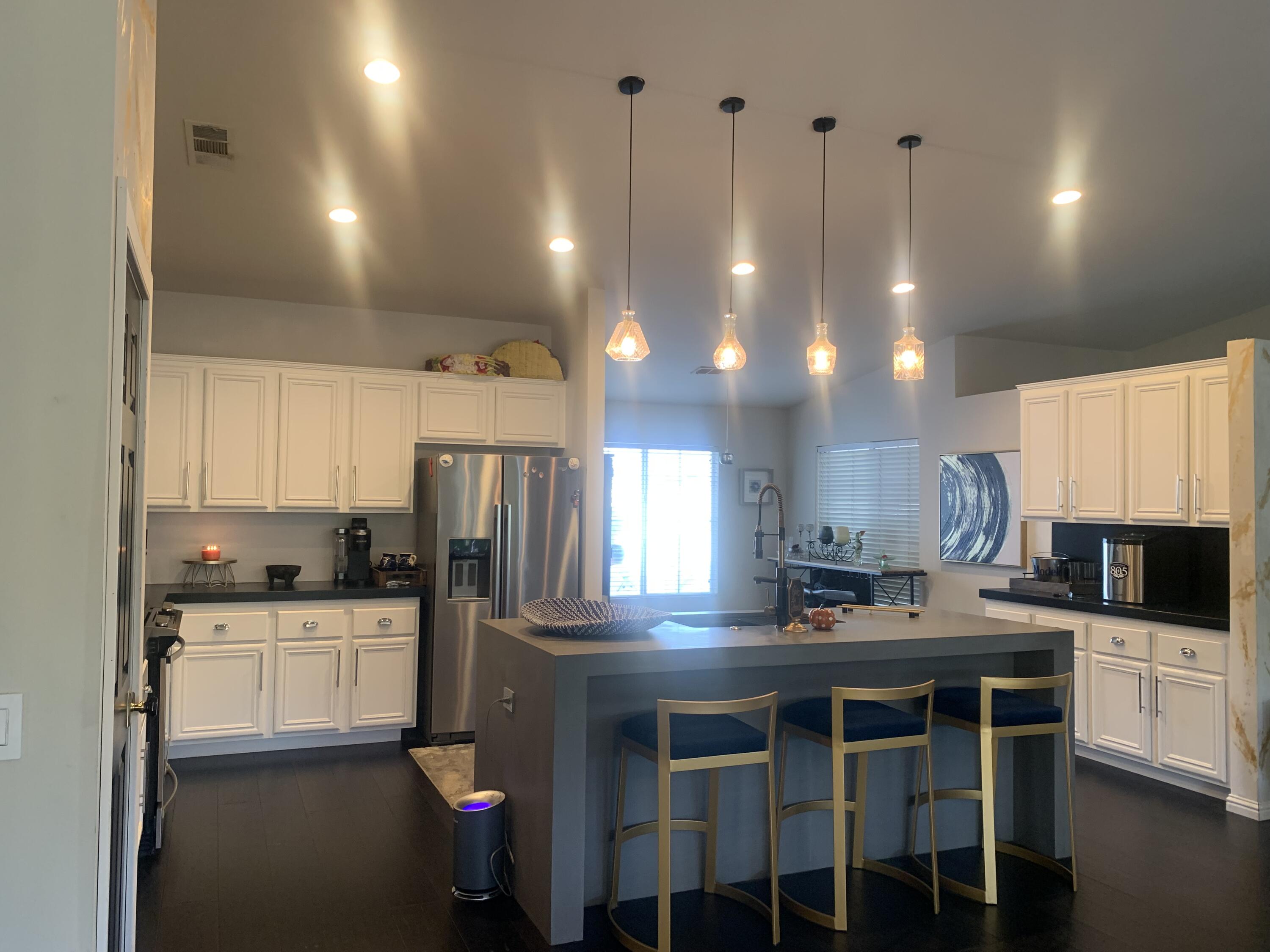 81059 Aurora Avenue Indio, CA 92201 - Photo 12 of 26 a kitchen with counter top space cabinets and appliances