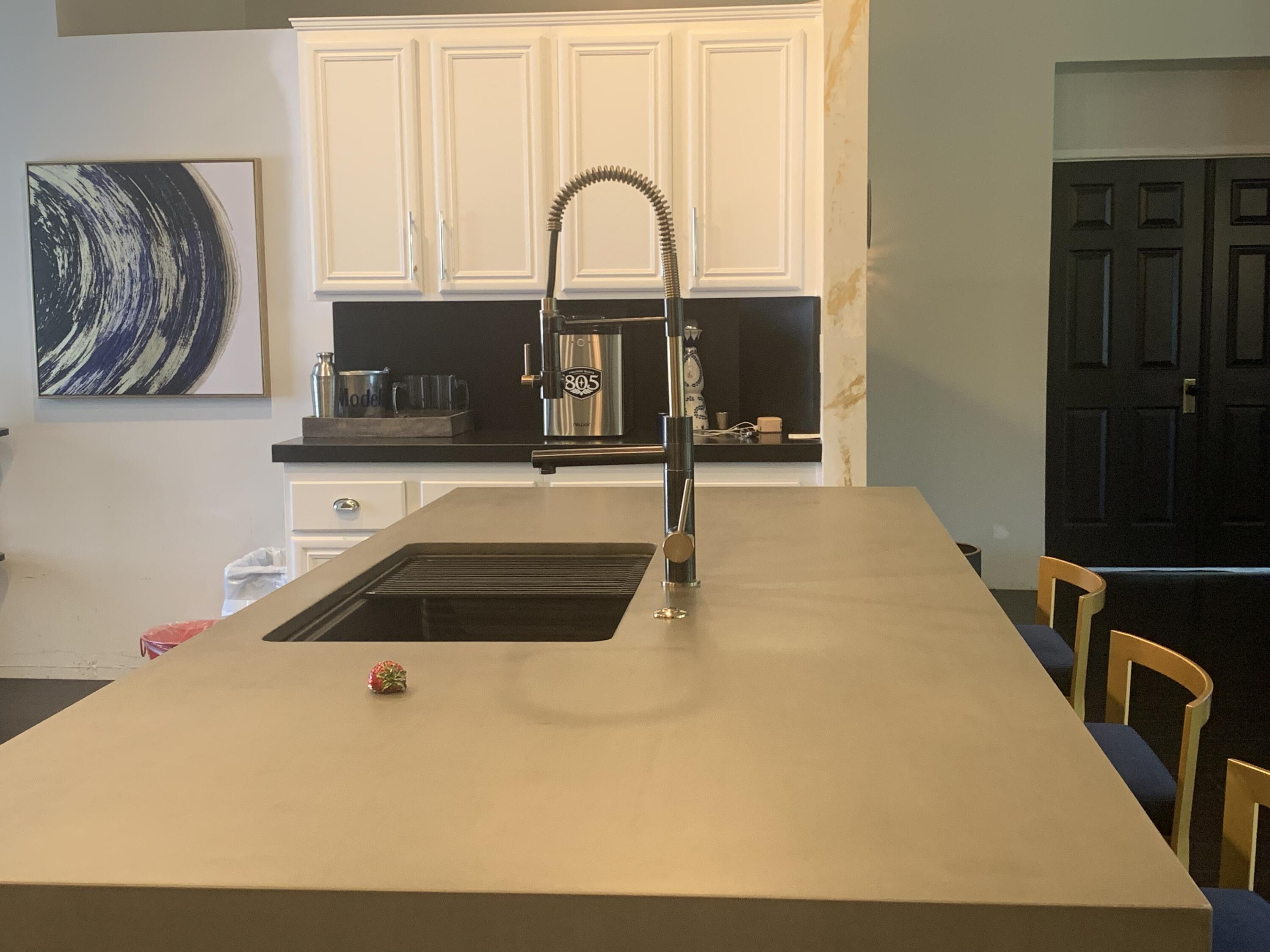 81059 Aurora Avenue Indio, CA 92201 - Photo 18 of 26 a kitchen with a stove a sink and a window