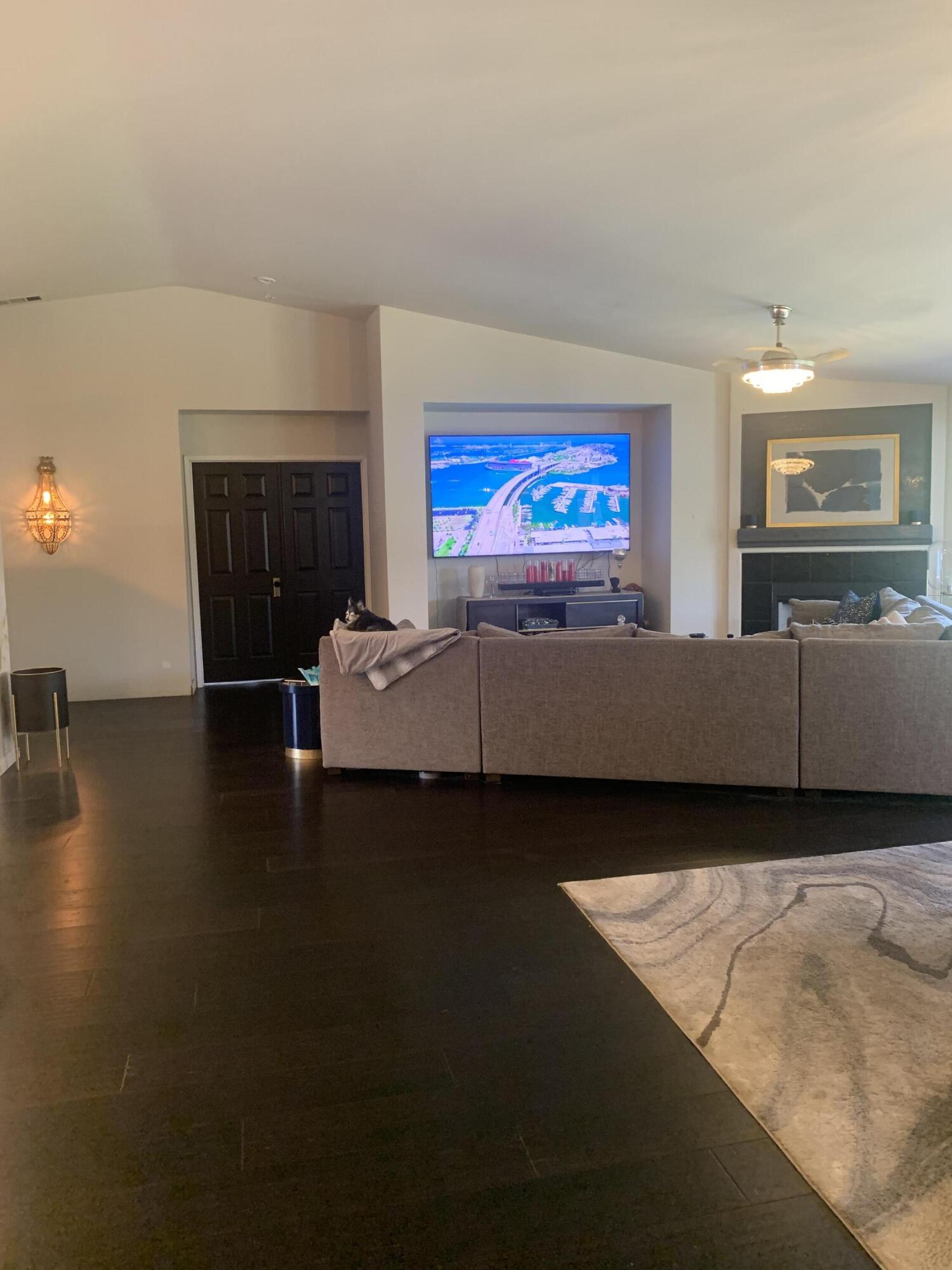 81059 Aurora Avenue Indio, CA 92201 - Photo 20 of 26 a living room with furniture and a flat screen tv