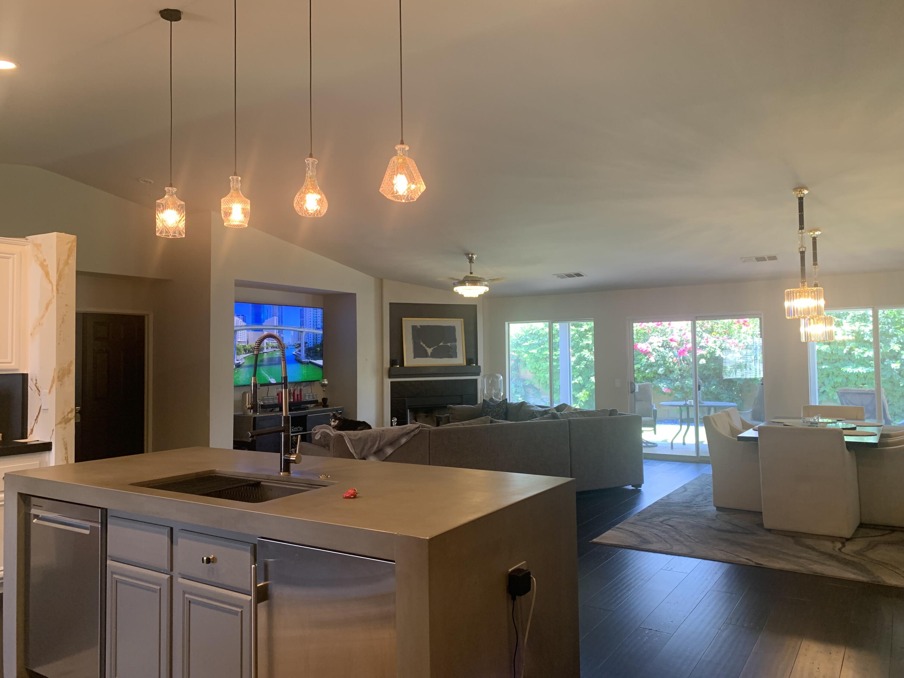 81059 Aurora Avenue Indio, CA 92201 - Photo 22 of 26 a kitchen with a sink cabinets and wooden floor