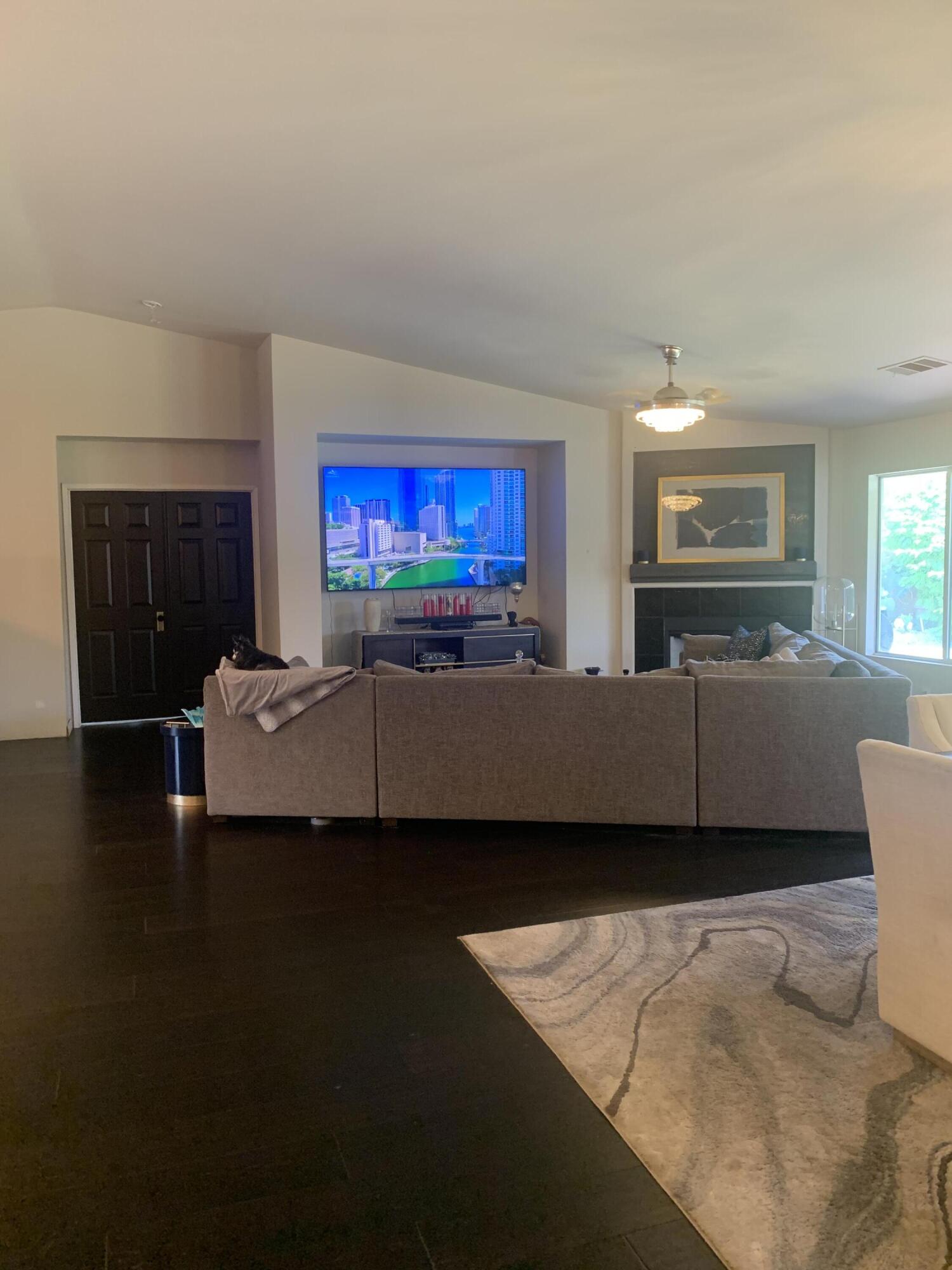 81059 Aurora Avenue Indio, CA 92201 - Photo 23 of 26 a living room with furniture and a flat screen tv