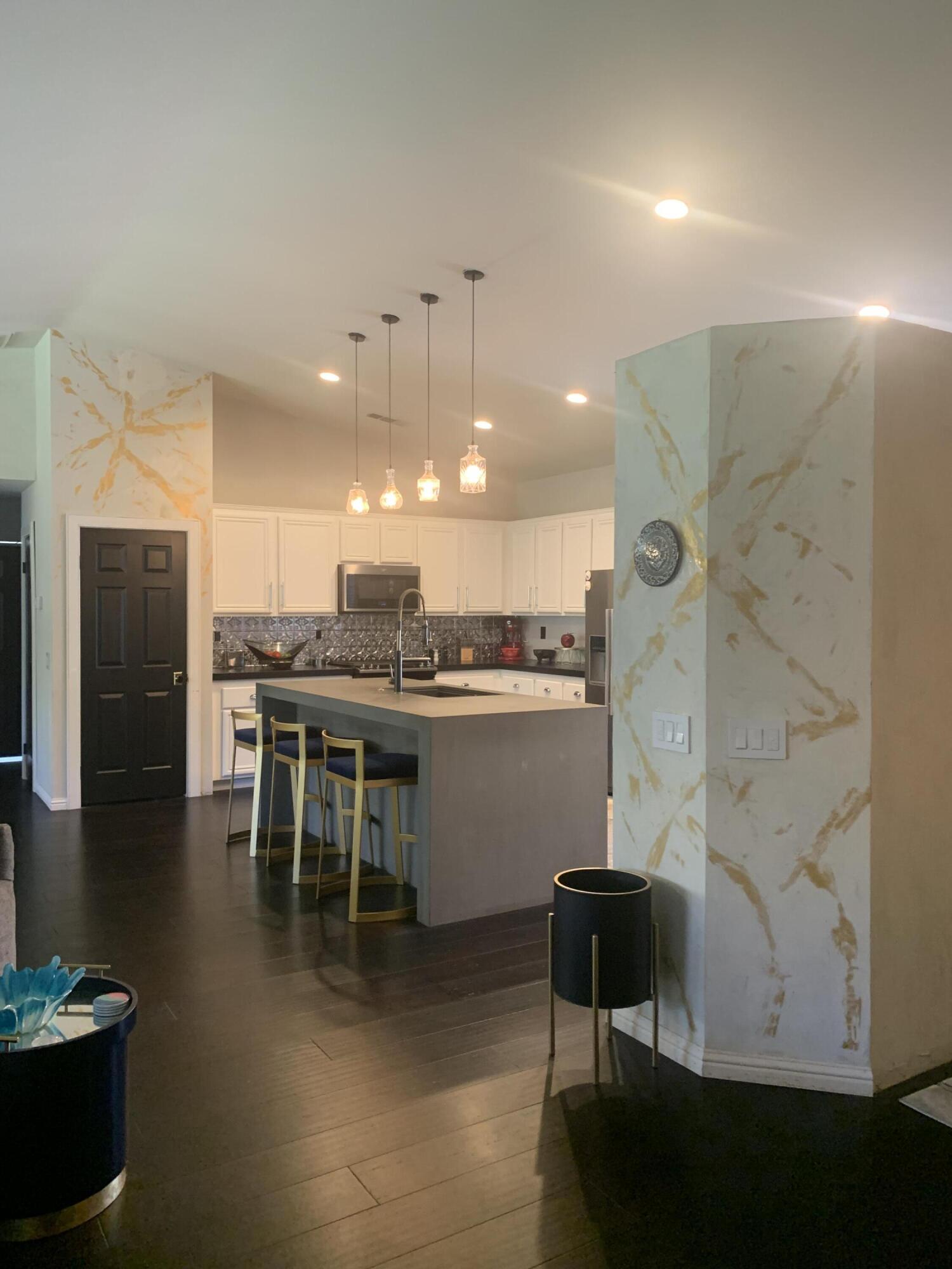 81059 Aurora Avenue Indio, CA 92201 - Photo 25 of 26 a kitchen with a table and chairs in it
