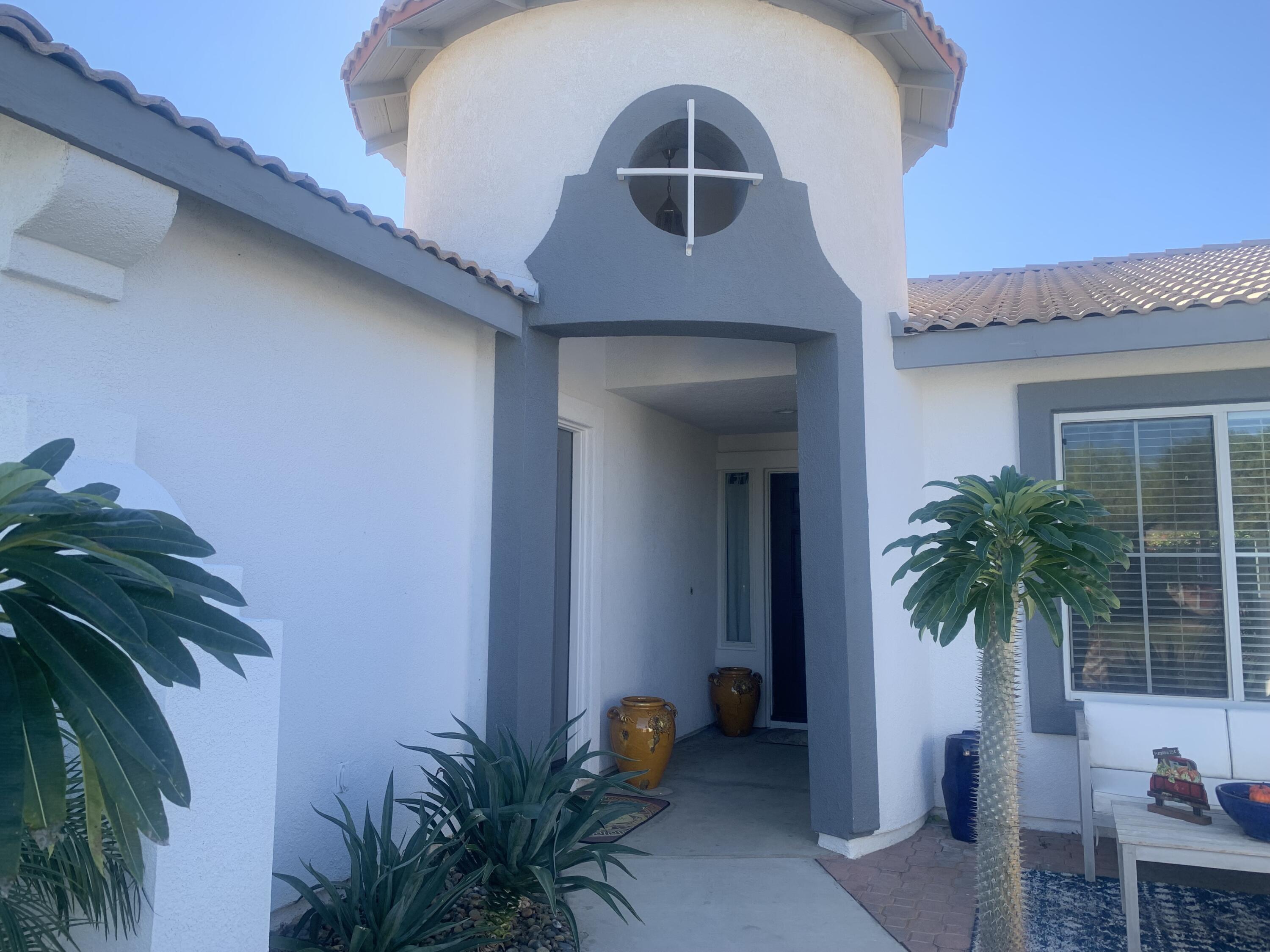 81059 Aurora Avenue Indio, CA 92201 - Photo 5 of 26 a front view of a house with a yard