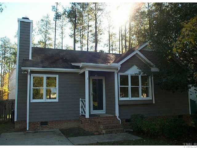 405 Cross Pines Drive Raleigh, NC 27603 - Photo 1 of 1 a front view of a house with a yard and garage