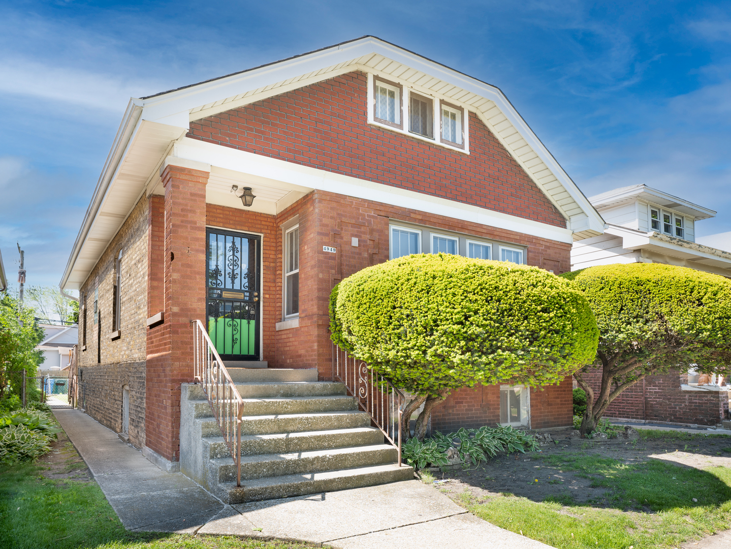 4949 West Deming Place Chicago, IL 60639 - Photo 1 of 18 a front view of a house with a yard