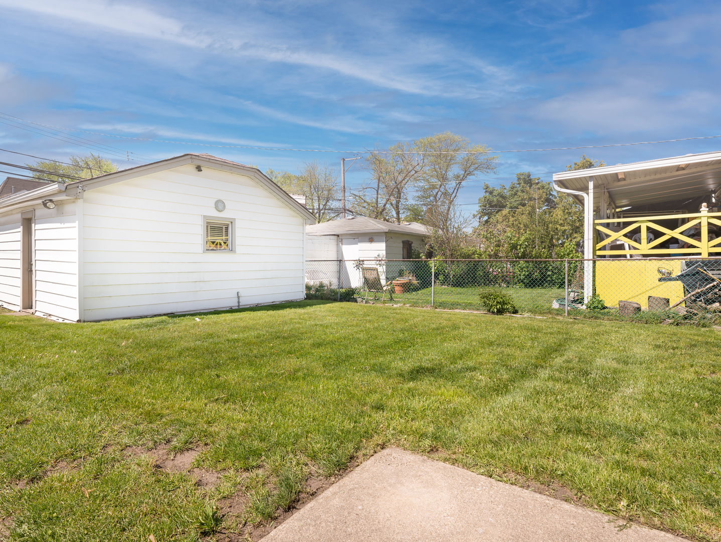 4949 West Deming Place Chicago, IL 60639 - Photo 16 of 18 a view of a house with a backyard