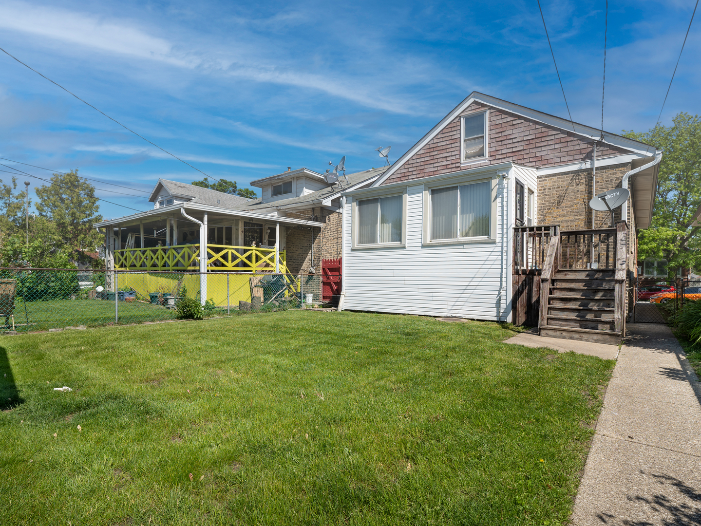 4949 West Deming Place Chicago, IL 60639 - Photo 17 of 18 a front view of a house with a yard