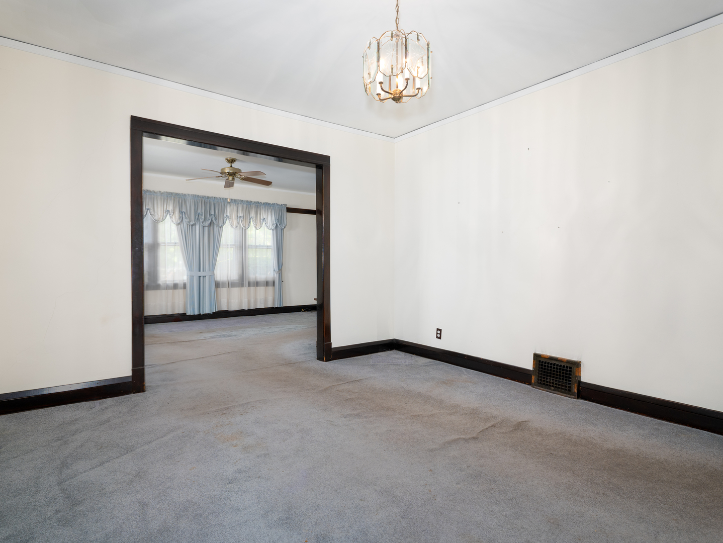 4949 West Deming Place Chicago, IL 60639 - Photo 4 of 18 an empty room with a chandelier
