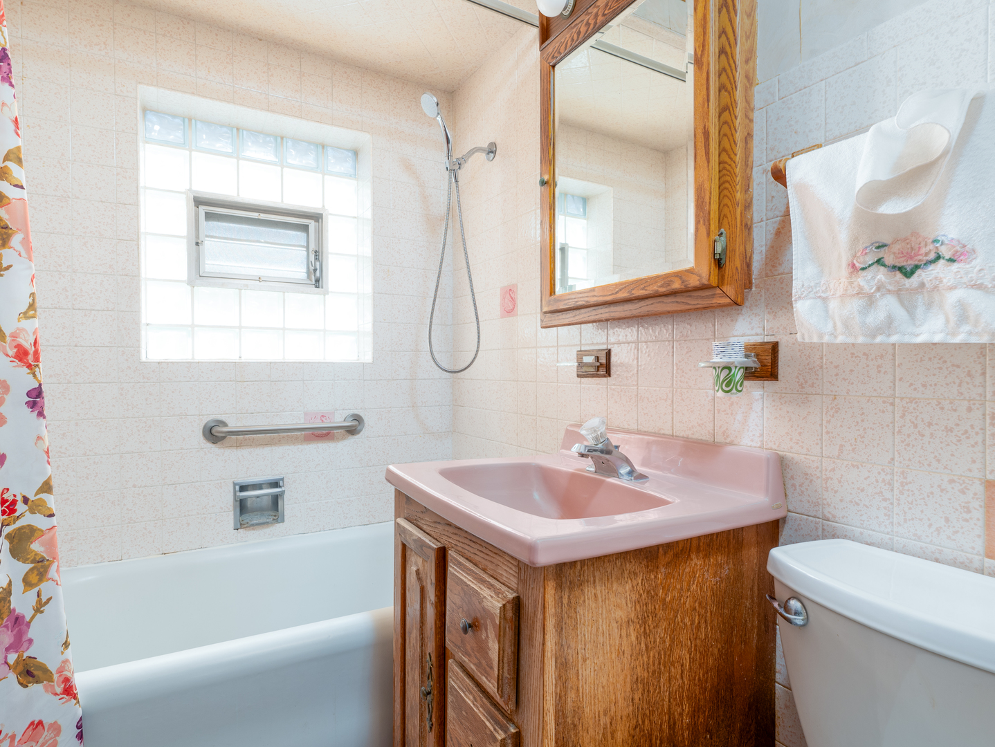 4949 West Deming Place Chicago, IL 60639 - Photo 10 of 18 a bathroom with a sink a toilet and a bathtub