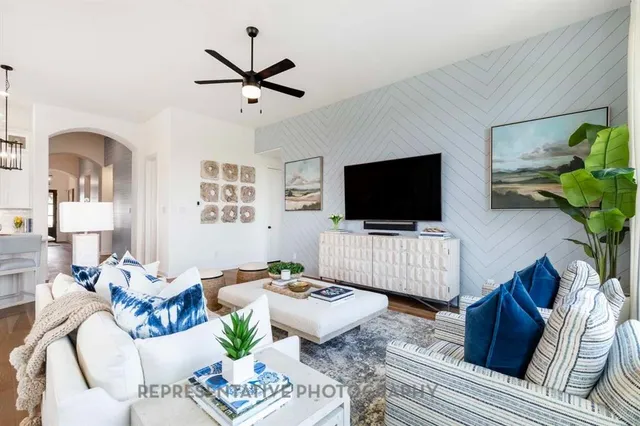 a living room with furniture and a flat screen tv