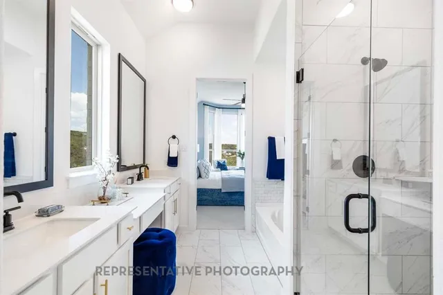 a bathroom with a sink double vanity and shower
