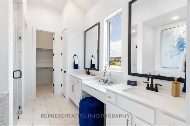 a bathroom with a double vanity sink mirror and double