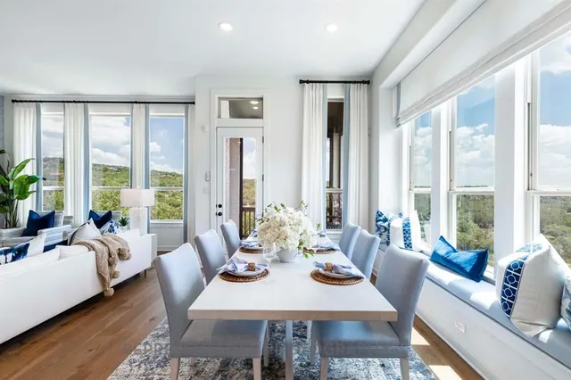 a view of a dining room with furniture window and wooden floor