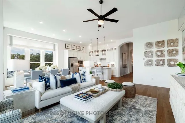 a living room with furniture and a rug