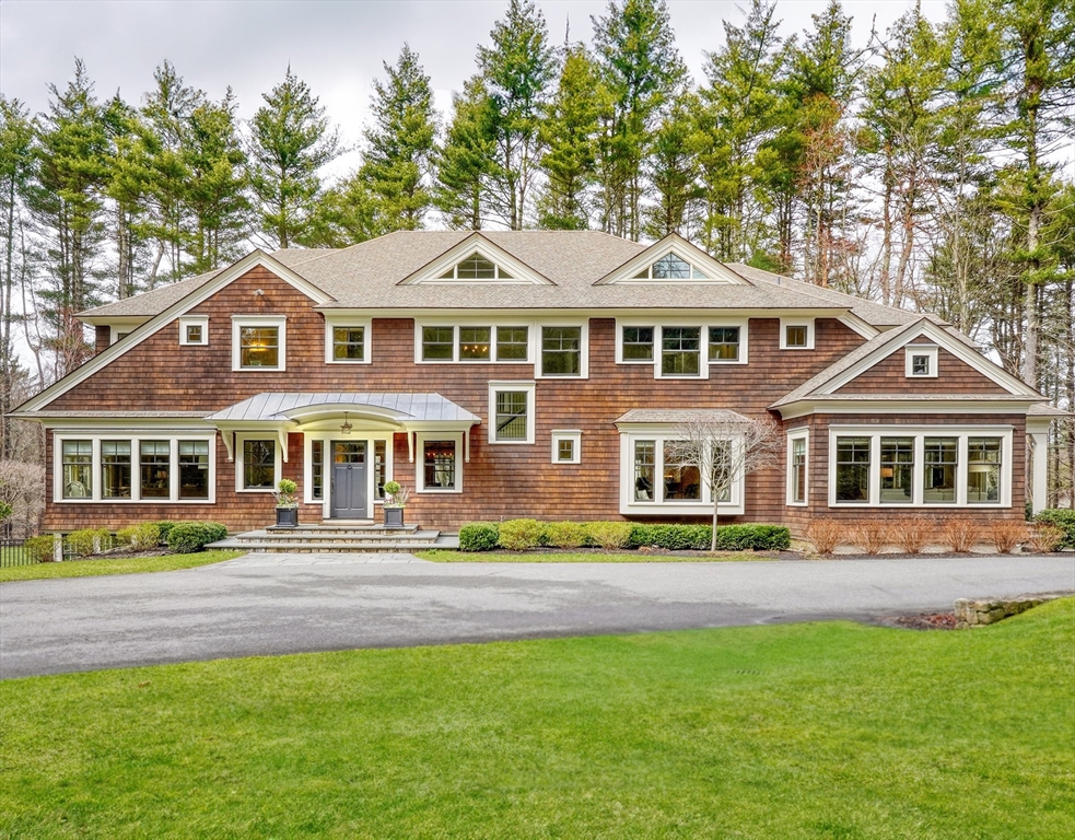 119 Lincoln Road Wayland, MA 01778 - Photo 1 of 40 a front view of a house with a garden